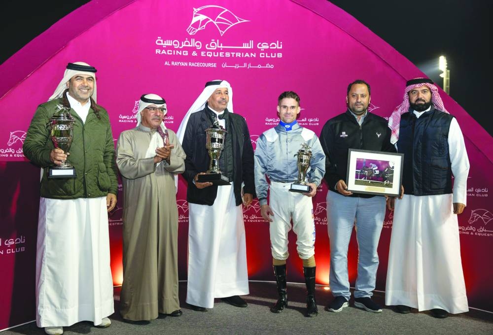Connections of X Force pose with QREC Racing Manager Abdulla Rashid al-Kubaisi at the presentation ceremony.