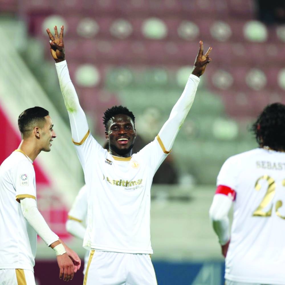 Qatar Sports Club’s Ben Malango Ngita celebrates after scoring a hat-trick against Al Gharafa yesterday. 
