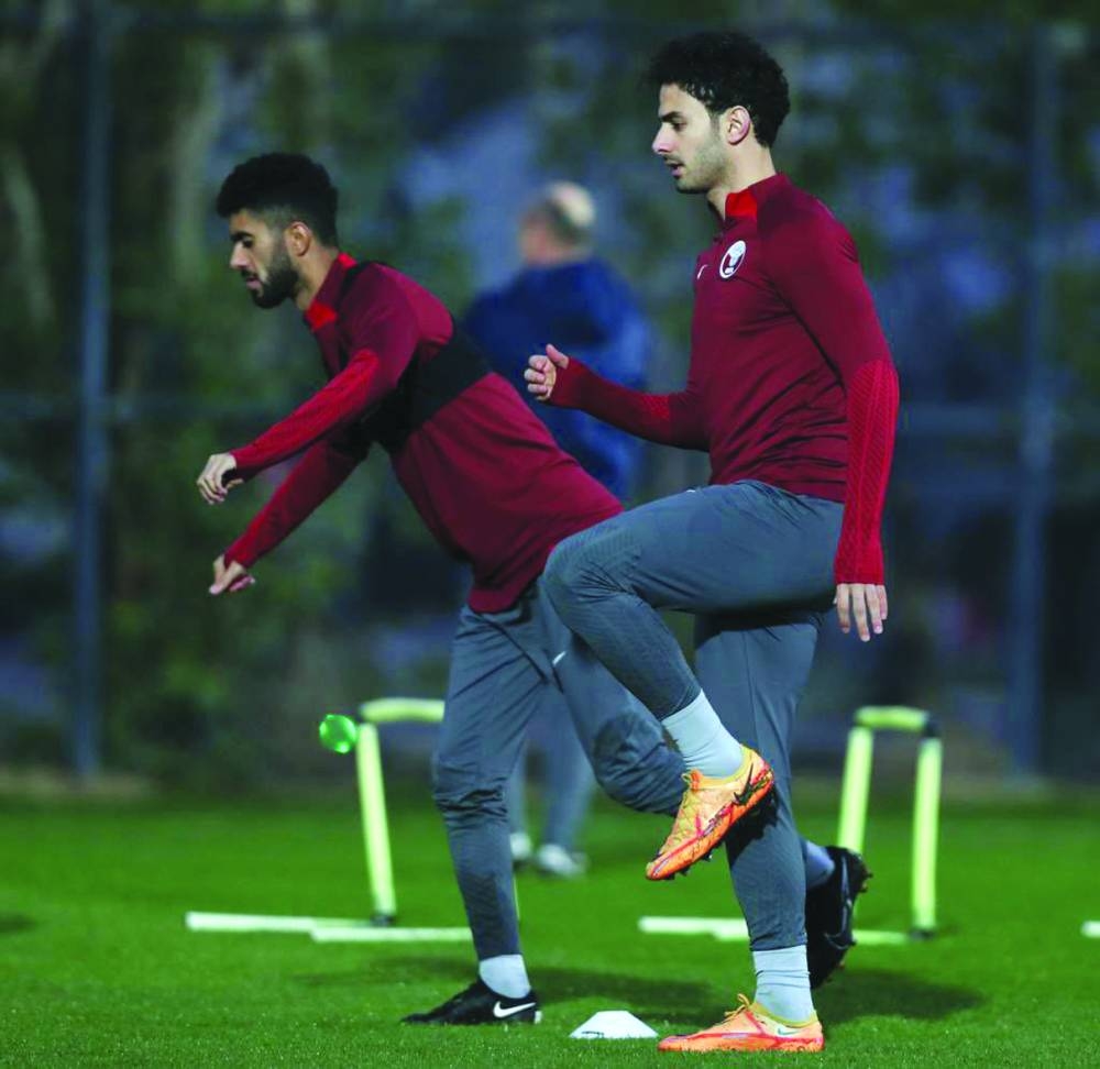     Qatar players break a sweat during their team training session in Basra, Iraq, on Thursday.


