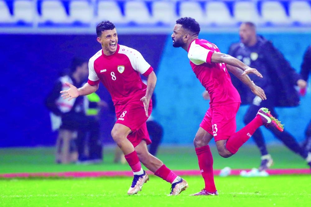 Oman players celebrate a goal during their Arabian Gulf Cup match against Saudi Arabia in Basra, Iraq. Oman won 2-1 to qualify for the semi-finals.