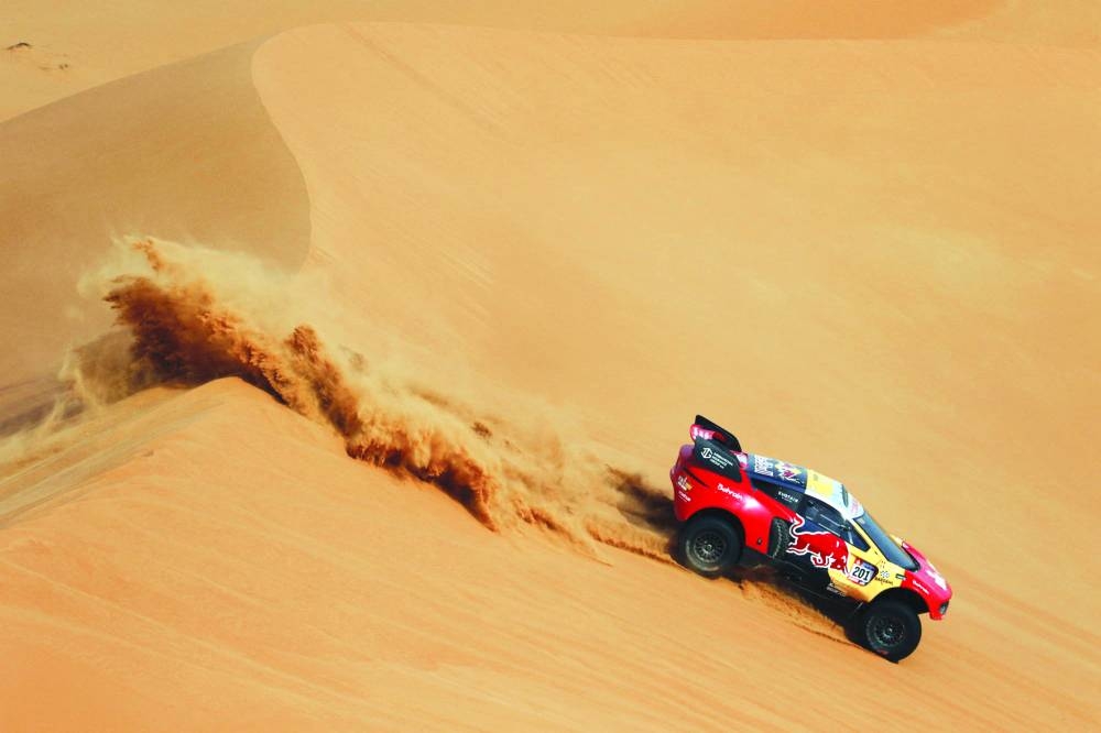 Bahrain Raid Xtreme’s Sebastien Loeb and his co-driver Fabian Lurquin in action during stage 12 of the Dakar Rally between Empty Quarter and Sheybah in Saudi Arabia on Friday. (Reuters)