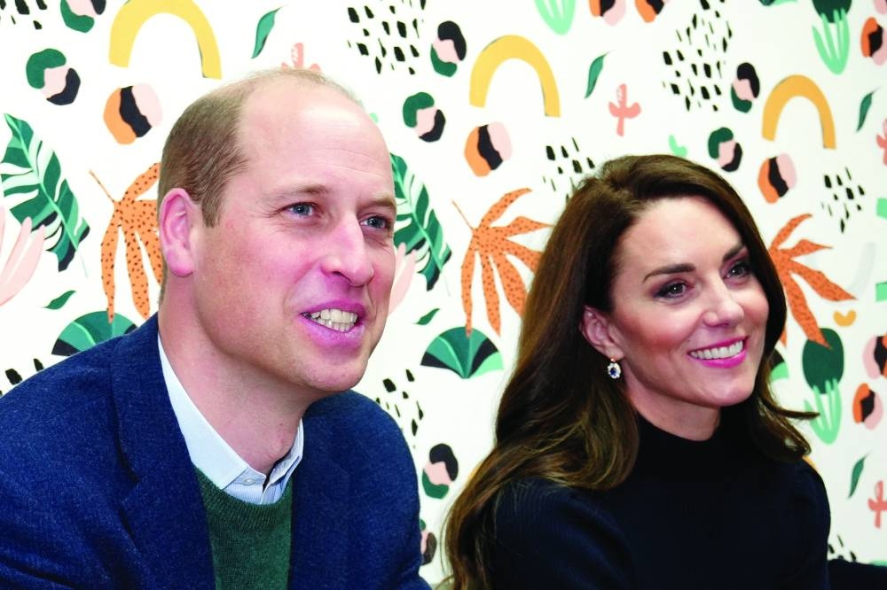 Kate, Princess of Wales, and Prince William listen to young adults in the 'Mentor Room' during a visit to the Open Door Charity, a charity focused on supporting young adults across Merseyside with their mental health, using culture and creativity as the catalyst for change, in Birkenhead, England, on Thursday.