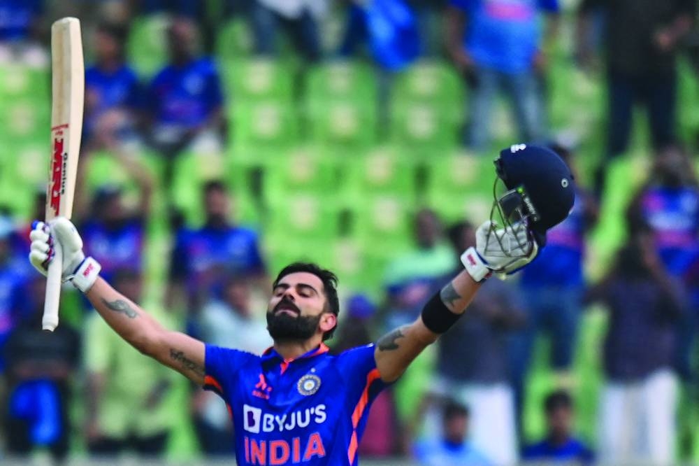India’s Virat Kohli celebrates after scoring a century during the third and final one-day international (ODI) against Sri Lanka at the Greenfield International Stadium in Thiruvananthapuram yesterday. Right: India’s Mohamed Siraj celebrates after taking the wicket of Sri Lanka’s Avishka Fernando (right) during the third ODI. (AFP)