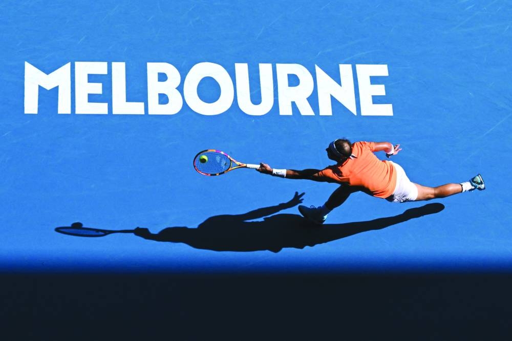 Spain’s Rafael Nadal hits a return against Britain’s Jack Draper during their singles match on day one of the Australian Open in Melbourne yesterday. Nadal won 7-5, 2-6, 6-4, 6-1. (AFP)