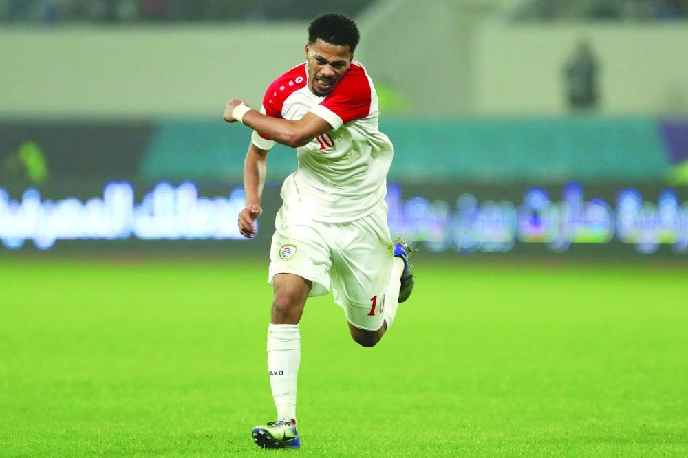 Oman’s Jameel al-Yahmadi celebrates after scoring against Bahrain during the Arabian Gulf Cup semi-final at the Al Minaa Olympic Stadium in Iraq’s southern city of Basra. (AFP)