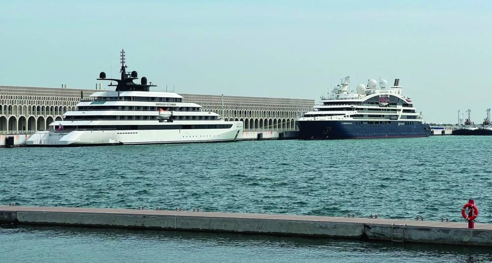 'Le Bougainville' and 'Emerald Azzurra' can be seen docked at Doha Port.