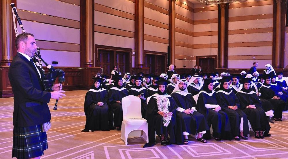 The bagpiper playing the traditional music as graduates look on. PICTURE: Shaji Kayamkulam