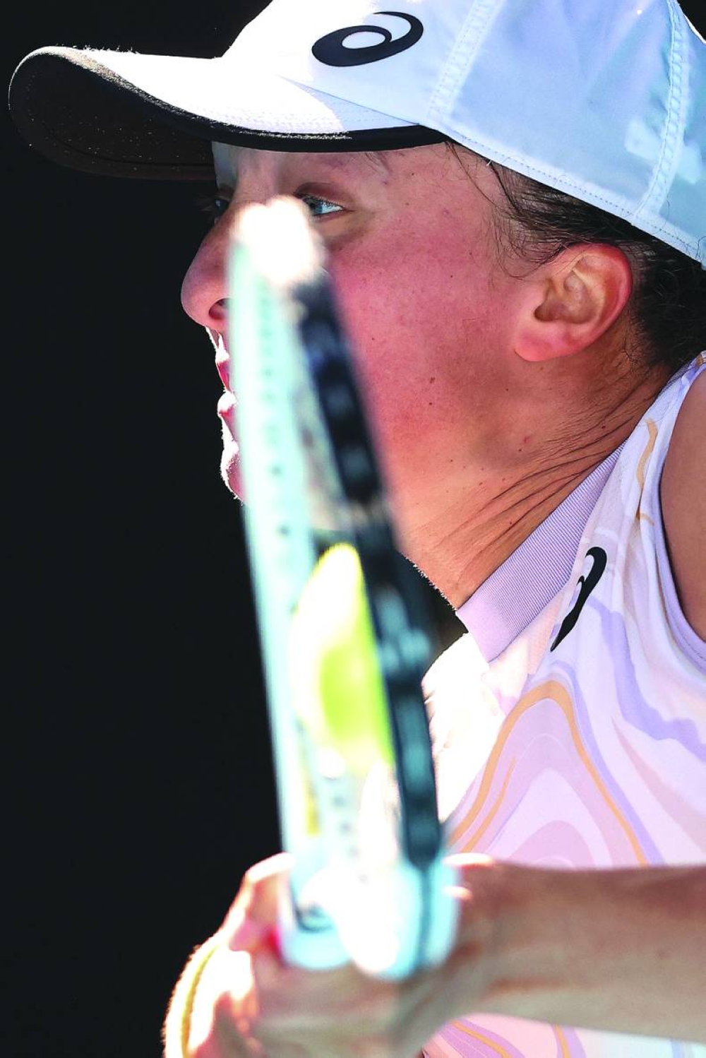 Poland's Iga Swiatek hits a return against Spain's Cristina Bucsa during their singles match on day five of the Australian Open in Melbourne on Friday. (AFP)