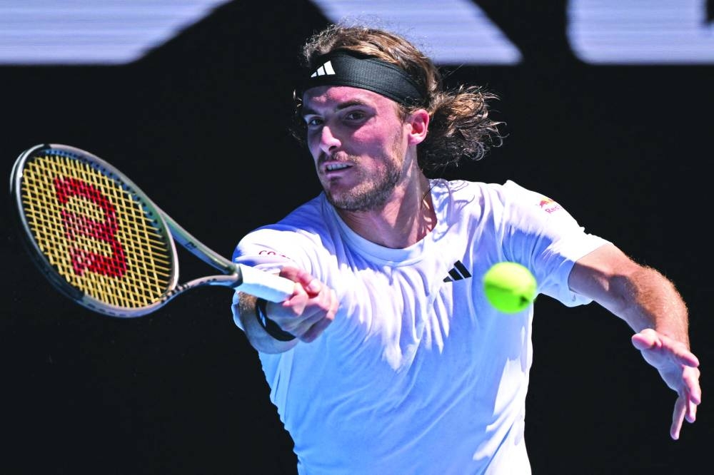 Greece's Stefanos Tsitsipas hits a return against Netherlands' Tallon Griekspoor during their men's singles match on day five of the Australian Open tennis tournament in Melbourne on Friday. (AFP)