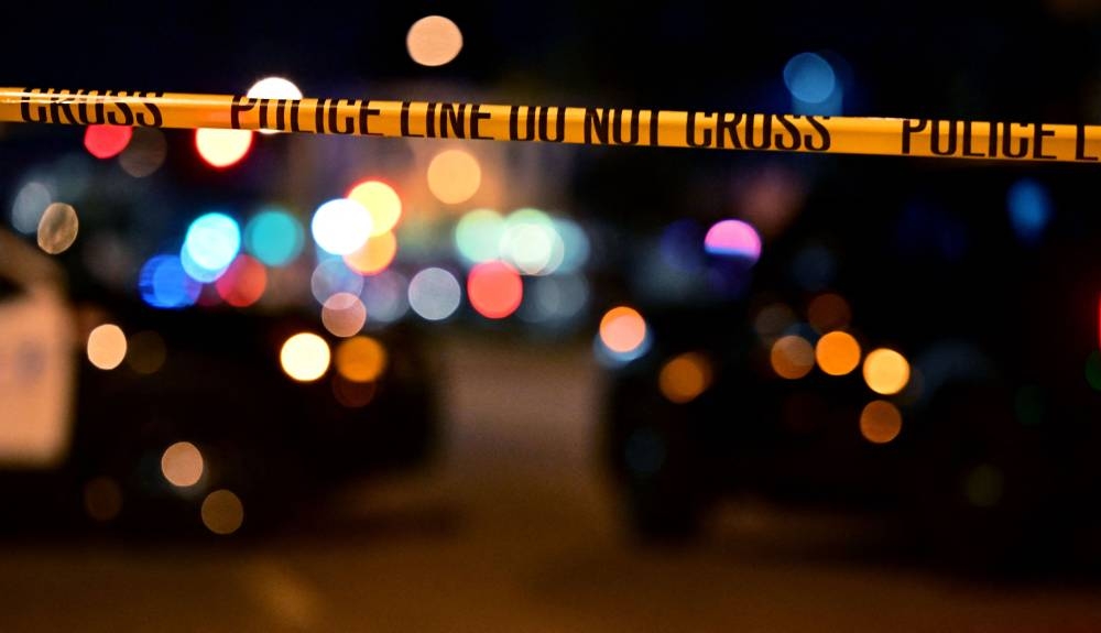 Police tape is pictured at the scene near the intersection of Garvey and Garfield Avenue in Monterey Park, California, on January 22, 2023, where police are responding to reports of multiple people shot. (AFP)