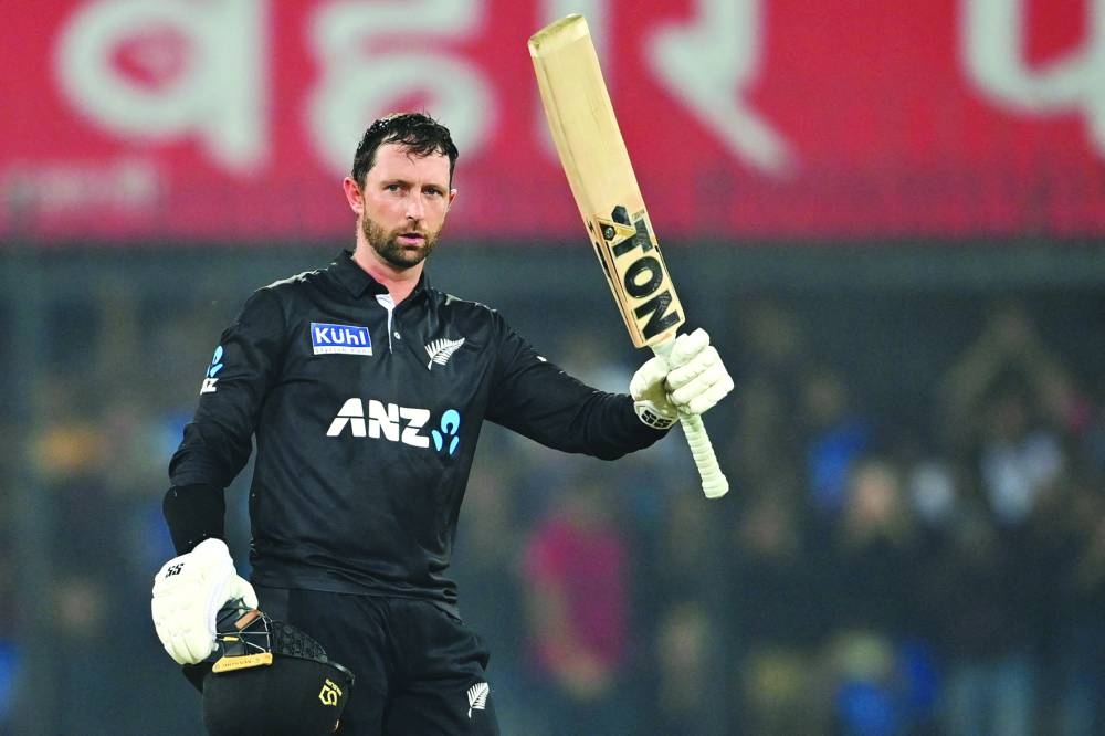 New Zealand’s Devon Conway celebrates after scoring a century during the third and final ODI against India in Indore yesterday. (AFP) 