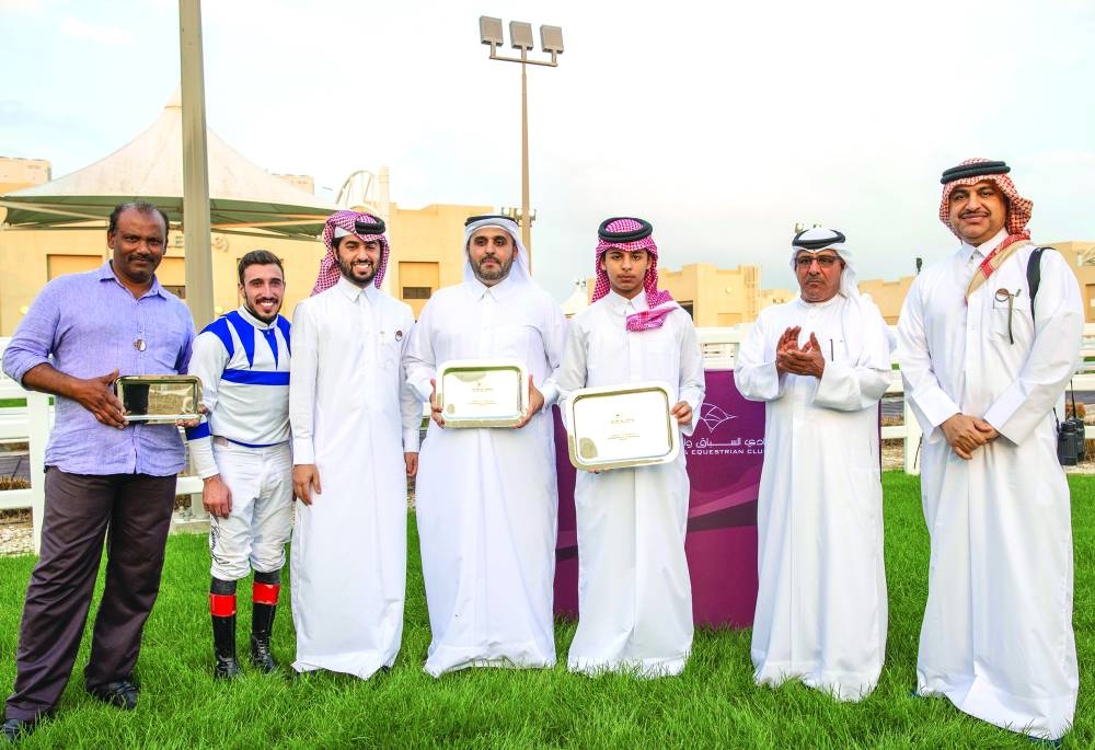 QREC Racing Manager Abdulla Rashid al-Kubaisi (second right) presented the trophies to connections of Wukair.