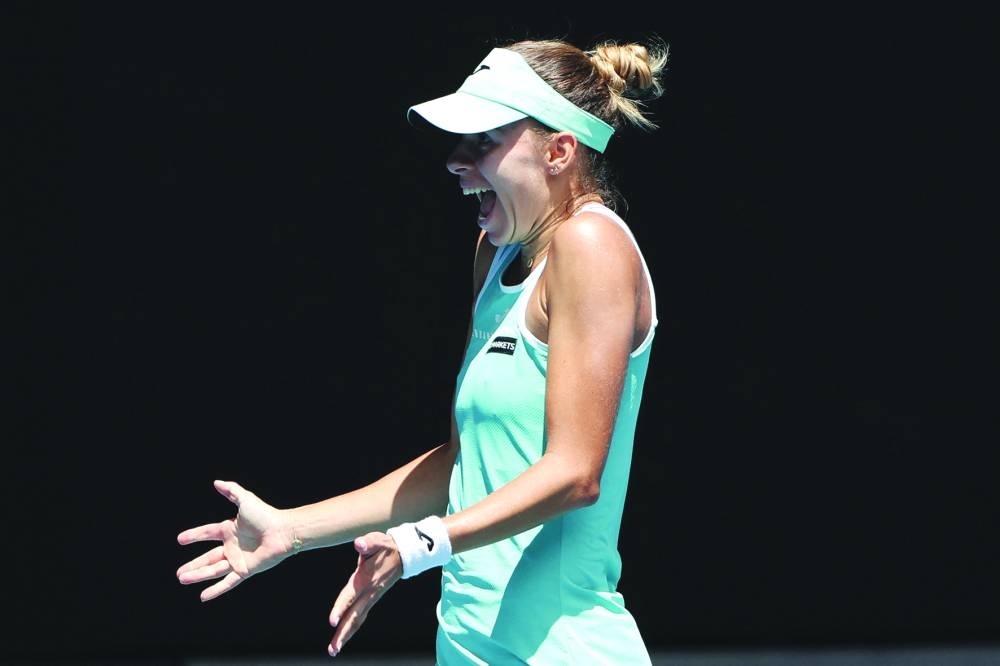Poland’s Magda Linette celebrates after her victory against Czech Republic’s Karolina Pliskova at the Australian Open. (AFP)