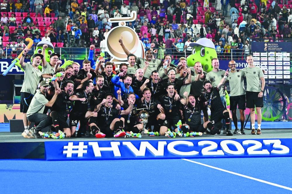 Germany’s players pose with the trophy after winning the FIH men’s Hockey World Cup 2023 at the Kalinga Stadium in Bhubaneswar yesterday. (AFP)