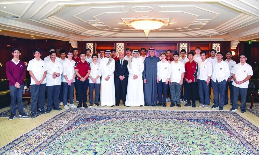 QIIB chairman Sheikh Dr Khalid bin Thani bin Abdullah al-Thani, CEO Dr Abdulbasit Ahmed al-Shaibei with officials and students of Qatar Academy at the bank headquarters recently.