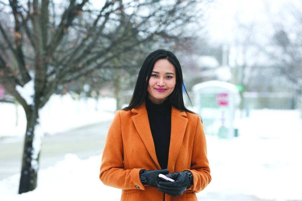 Myanmar’s beauty queen Han Lay, who had been exiled after speaking out against military rule in her country, poses while taking a walk in London, in Ontario, Canada.