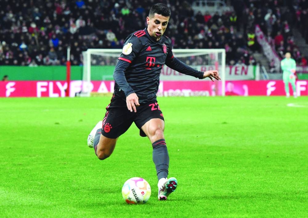 Bayern Munich’s Joao Cancelo controls the ball during the German Cup last 16 match against Mainz. (AFP)