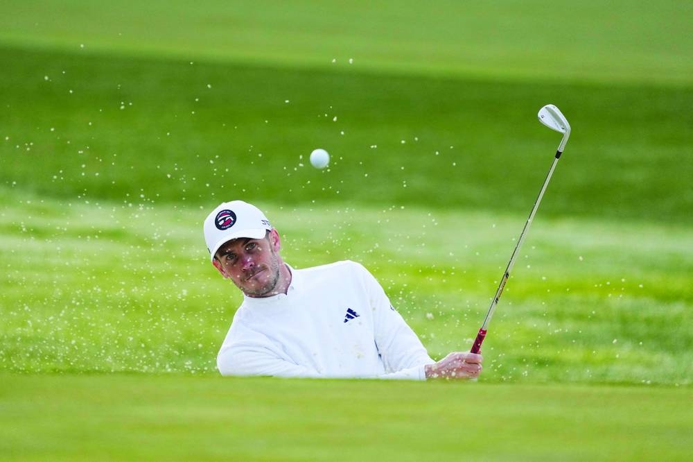 Former Real Madrid and Wales star Gareth Bale hits his bunker shot on the first hole during the first round of the AT&T Pebble Beach.  
(USA TODAY Sports)