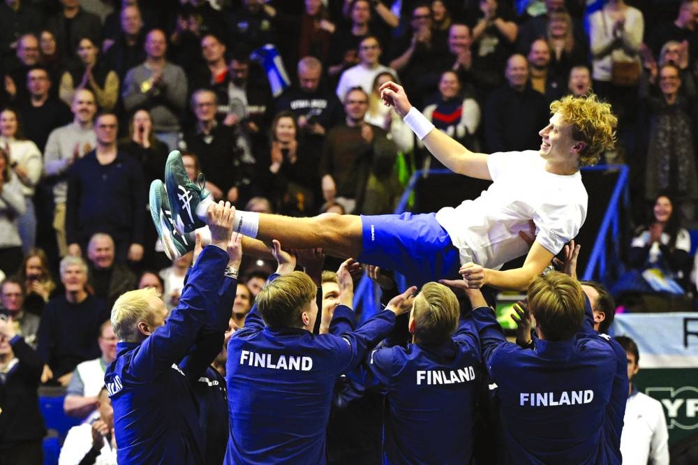 Finland’s Emil Ruusuvuori is thrown into the air as Team Finland celebrate after a 3-1 victory against Argentina during their Davis Cup clash in Espoo, Finland, yesterday. (Reuters)