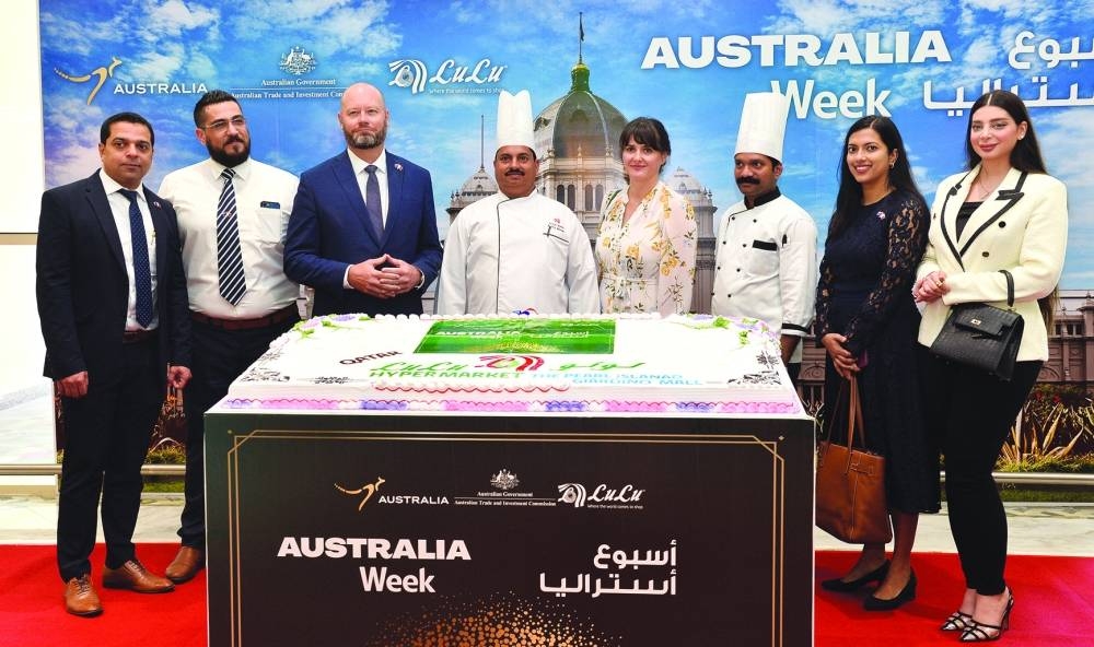 Jonathan Muir and his wife are joined by other guests during the cake-cutting ceremony. PICTURE: Shaji Kayamkulam