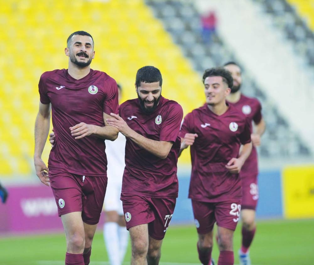 Al Markhiya players celebrate a goal during their QNB Stars League match against Qatar SC at Suheim Bin Hamad Stadium in Doha yesterday.