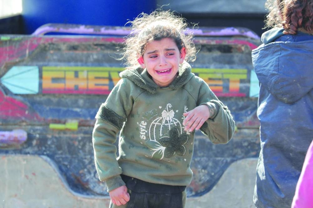 A girl reacts takes off after the earthquake in Jandaris yesterday. (Reuters)