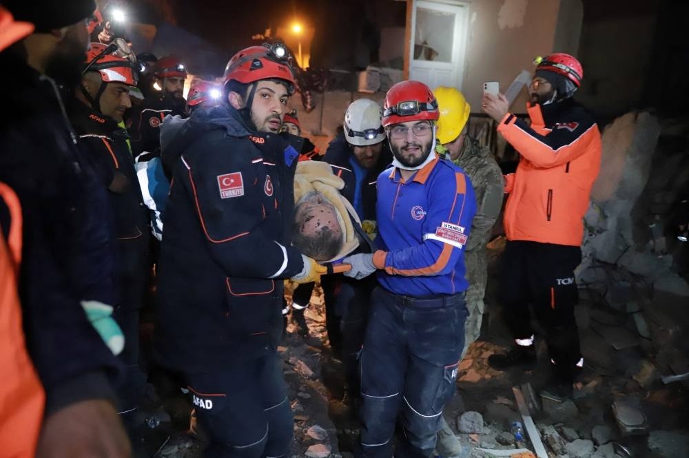 Suleyman Samar, a 64 year-old man, is carried to an ambulance after being rescued alive from rubbles in the aftermath of a deadly earthquake in Iskenderun, Turkey on Thursday. REUTERS