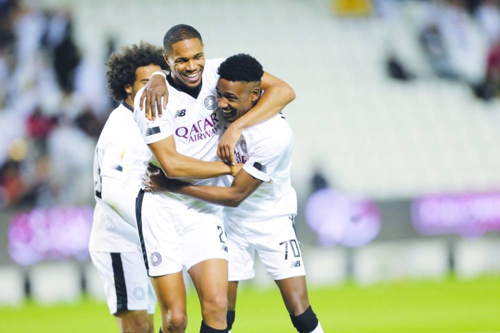 Al Sadd’s Musaab Khedir (right) celebrates with teammate Pedro Miguel after scoring against Al Arabi in the Qatar Cup semi-final at the Jassim Bin Hamad Stadium on Thursday.