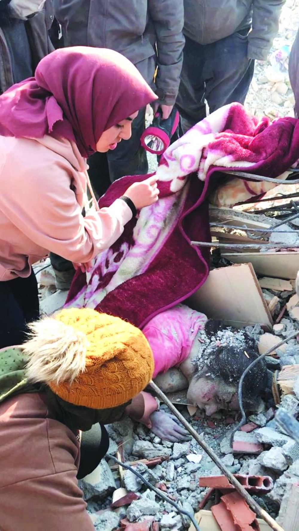 Rescuers help a woman who survived a deadly earthquake, after 128 hours under rubble, in Kahramanmaras yesterday in this still image obtained from social media video. (Reuters)