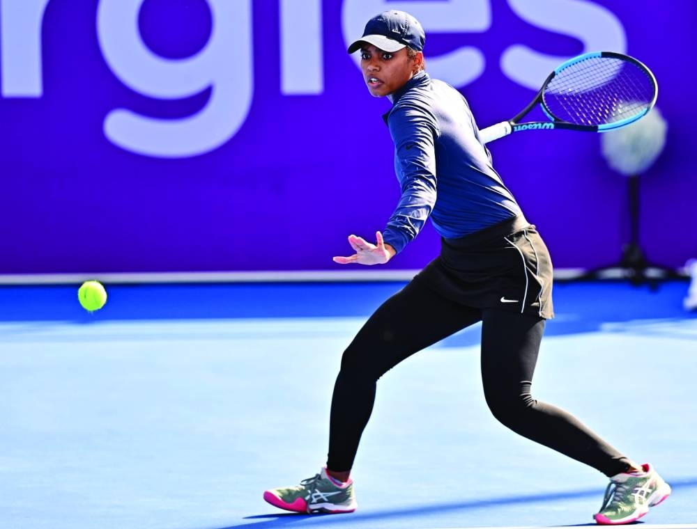 Qatar’s Mubaraka al-Naimi whips a forehand during her first-round qualifying match for the Qatar TotalEnergies Open against Elise Mertens of Belgium at the Khalifa Tennis and Squash Complex yesterday. Al-Naimi lost 0-6, 0-6. PICTURES: Noushad Thekkayil
