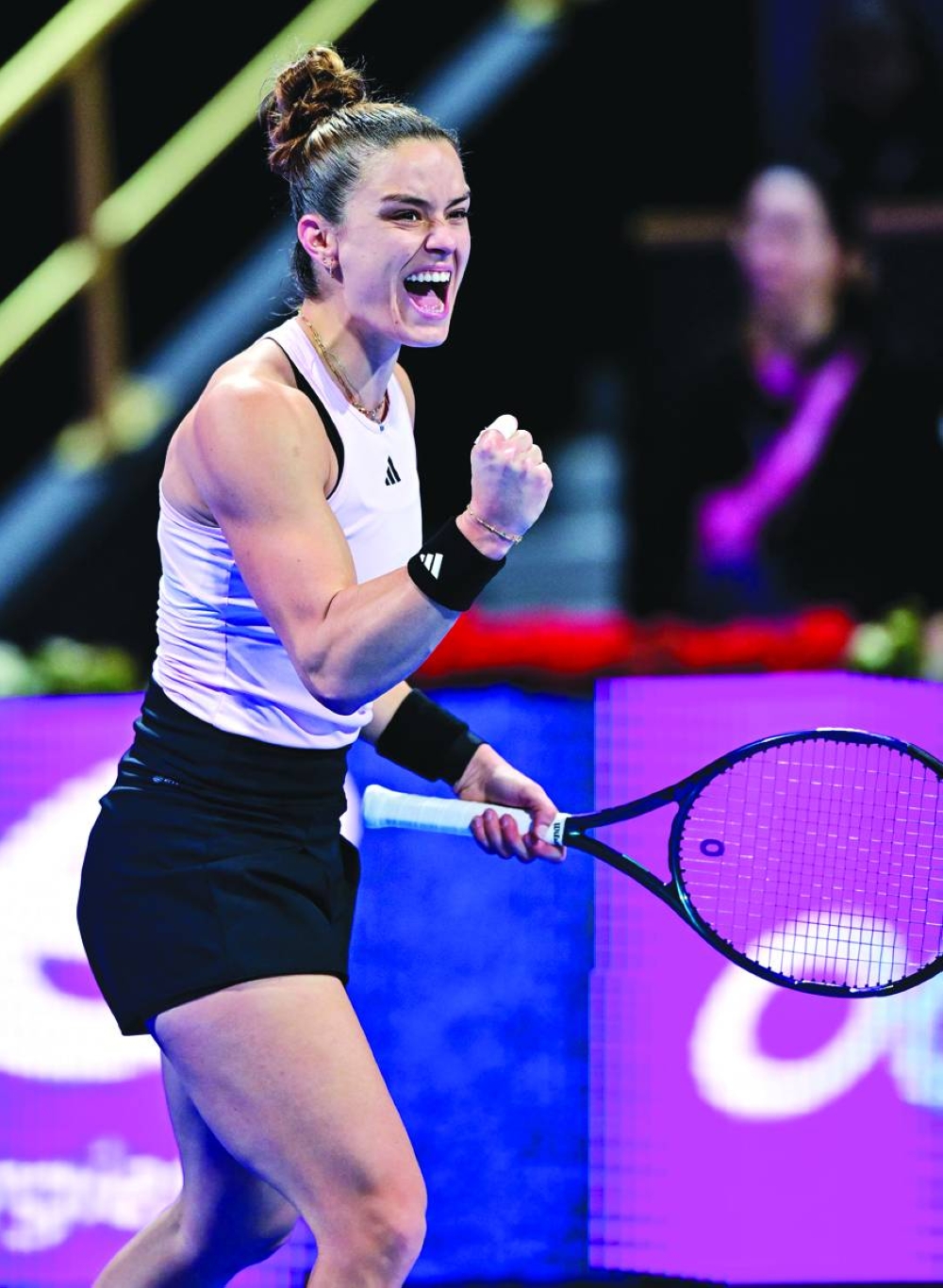 Maria Sakkari celebrates after winning a point against Qinwen Zheng. 