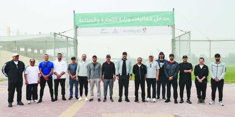 HE the Minister of Commerce and Industry Sheikh Mohamed bin Hamad bin Qassim al-Thani (ninth left) and other officials at the NSD event.