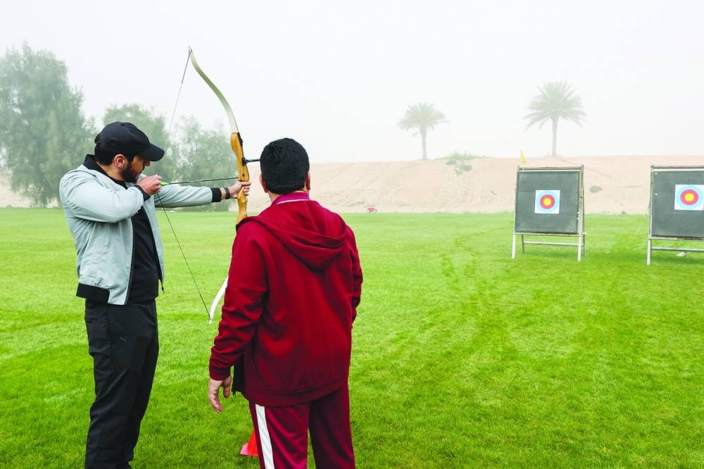 MoCI staff trying archery during NSD.