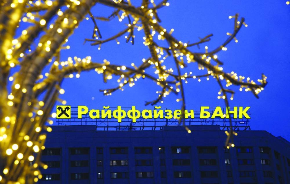 A signboard advertising Raiffeisen Bank behind an illuminated installation in Moscow earlier this month.  (Reuters)