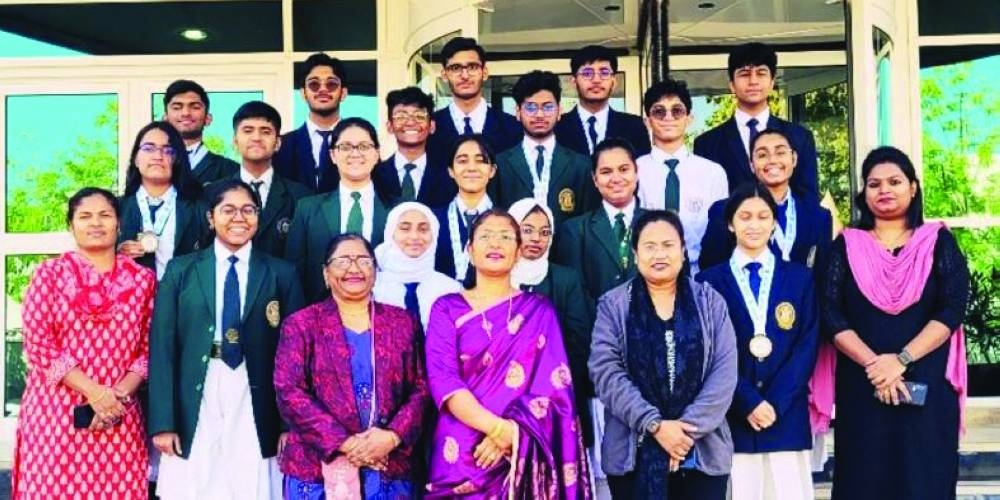 DPS-MIS debaters, the champions in the school category of Qatar Open Asian Parliamentary-style debate with school officials.