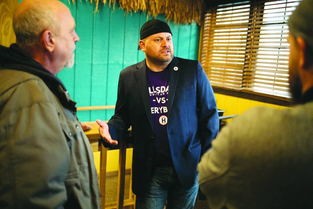 Candidate for district party chair for Michigan Republican Party, Jon Smith, speaks with guests during a fundraiser in Hillsdale, Michigan, US.