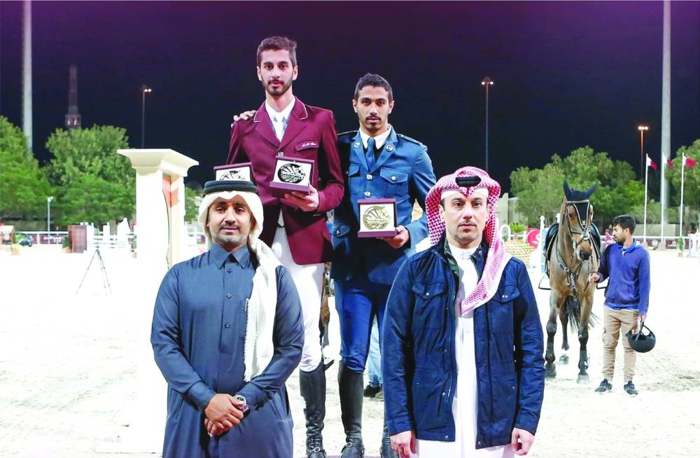 Vice-President of the higher organising committee for HH The Amir Sword for Showjumping and Dressage championship Omar al-Mannai (right) and Deputy Director Faisal al-Khala pose with the Big Tour podium winners.