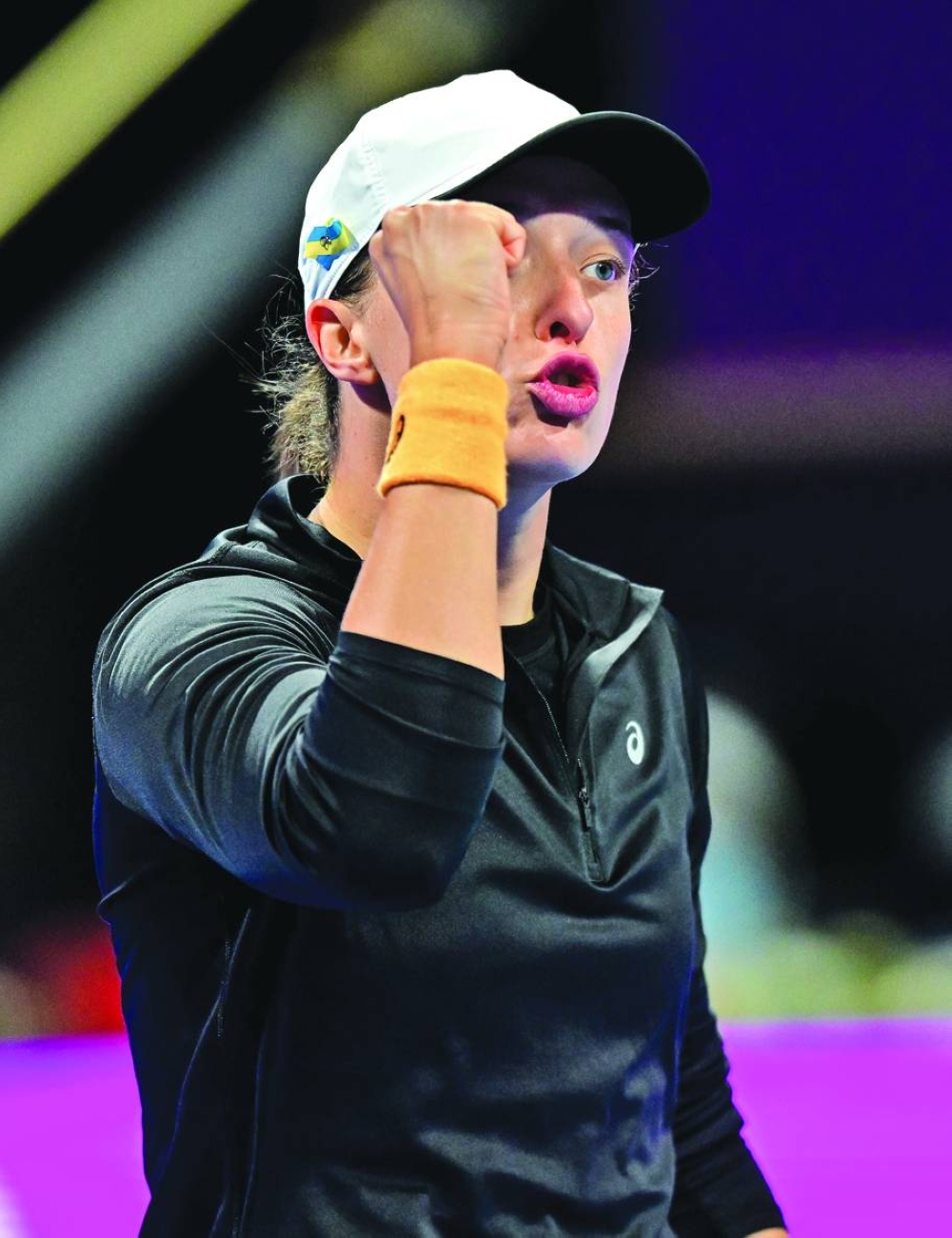 Poland’s lga Swiatek celebrates after winning her WTA Qatar TotalEnergies Open semi-final against Russia’s Veronika Kudermetova at the Khalifa International 
Tennis Complex in Doha yesterday. PICTURE: Noushad Thekkayil