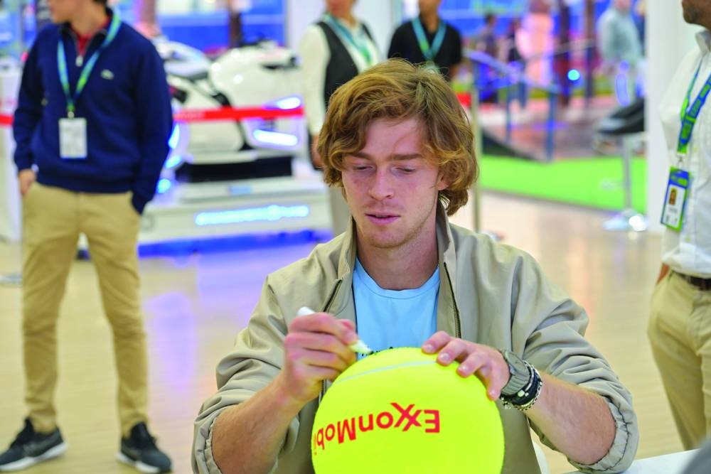 Andrey Rublev at ExxonMobil Qatar stand.