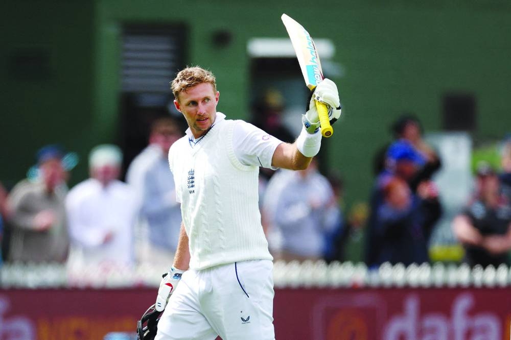 Joe Root celebrates after scoring an unbeaten 153 as England declare for 435 for 8 during day two of the second Test against New Zealand at the Basin Reserve in Wellington yesterday. (AFP)