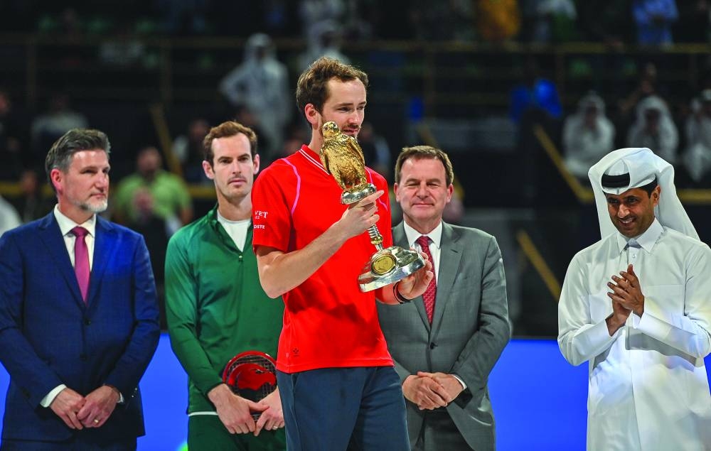 Daniil Medvedev celebrates winning the Qatar ExxonMobil Open final at the Khalifa Tennis and Squash Complex in Doha yesterday. Medvedev beat Andy Murray in the final. Qatar Tennis Federation (QTF) president Nasser al-Khelaifi was also present at the podium ceremony. PICTURE: Noushad Thekkayil
