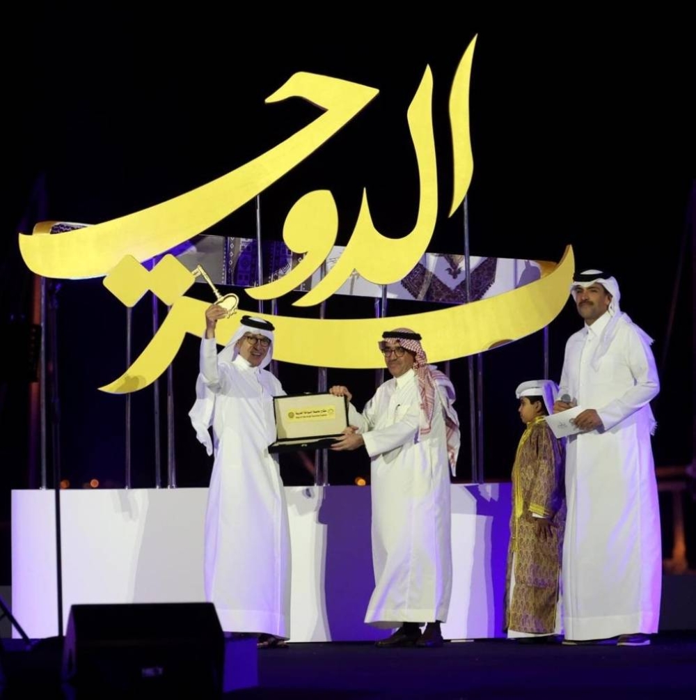HE Akbar al-Baker receiving the Arab Tourism Capital's key.