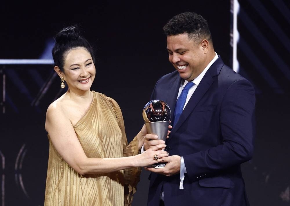 Pele's widow Marcia Aoki receives a Pele tribute trophy from Ronaldo during the Best FIFA Football Awards.