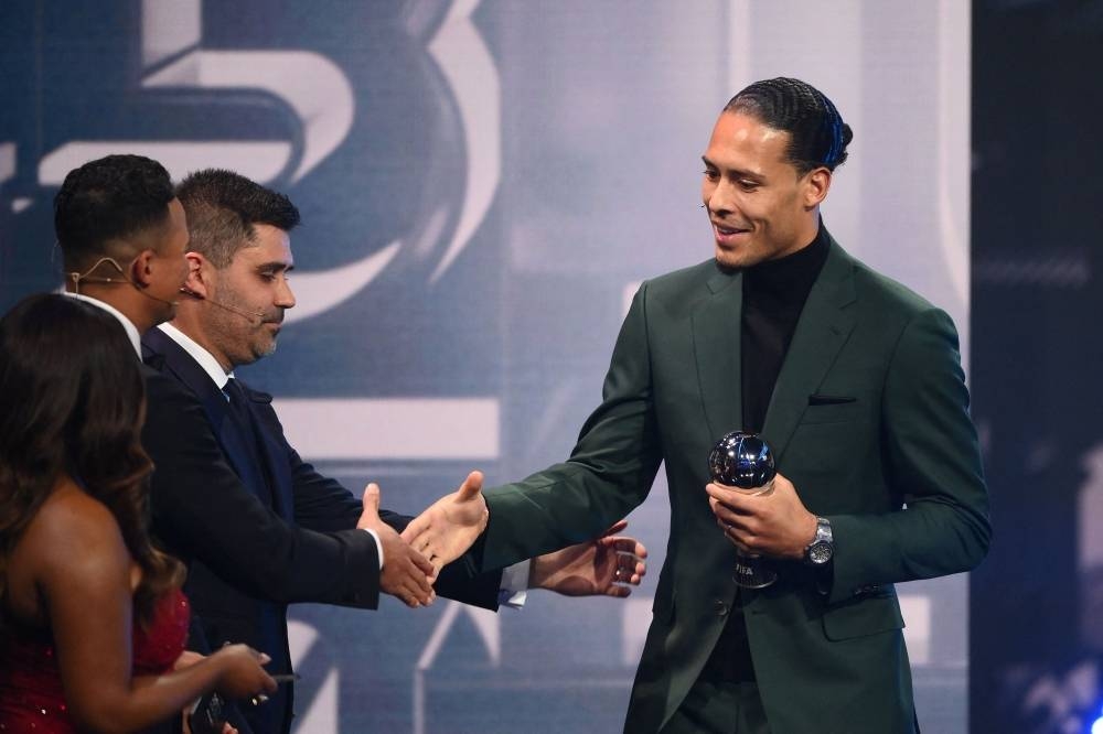 Netherlands and Liverpool defender Virgil van Dijk receives an award for the FIFA FIFPRO men's World11.