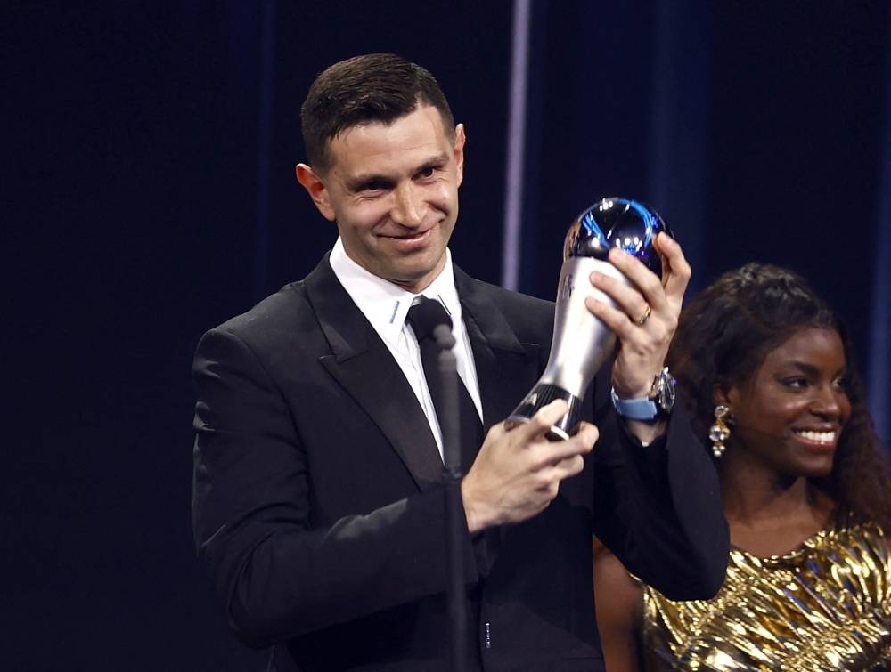 Aston Villa's Emilio Martinez receives the Best Goalkeeper award from Enjola Aluko during the Best FIFA Football Awards.