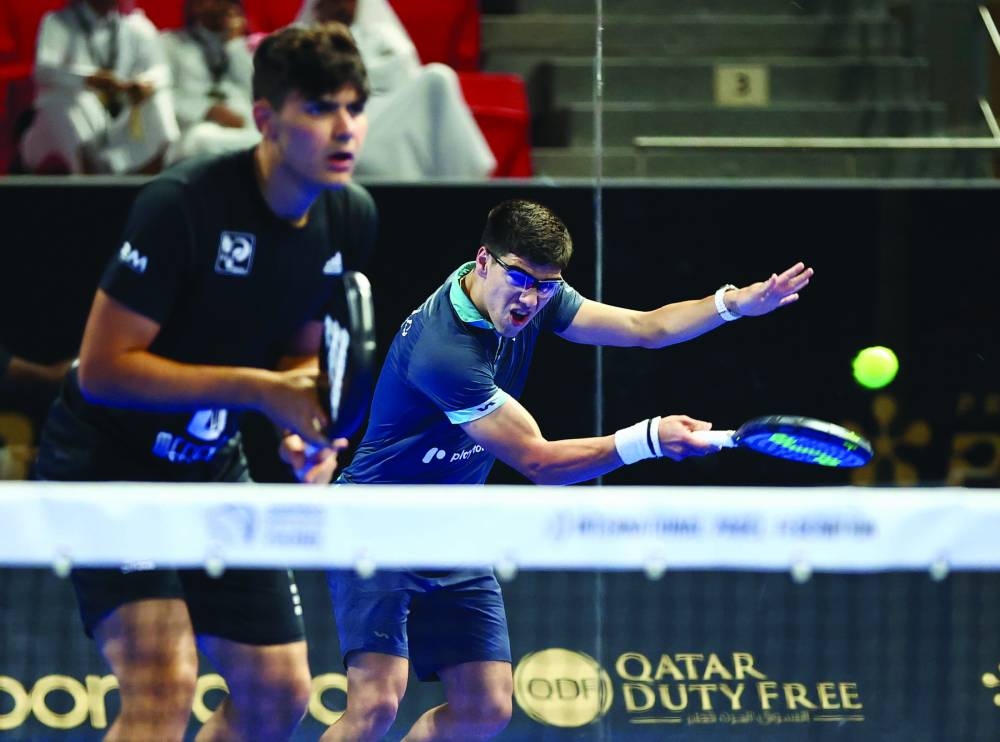 Spain’s Ivan Ramirez and Pablo Cardona in action against Qatar’s Mohamed Abdulla and Khalid Saadon al-Kuwari at Khalifa Tennis and Squash Complex in Doha yesterday. 