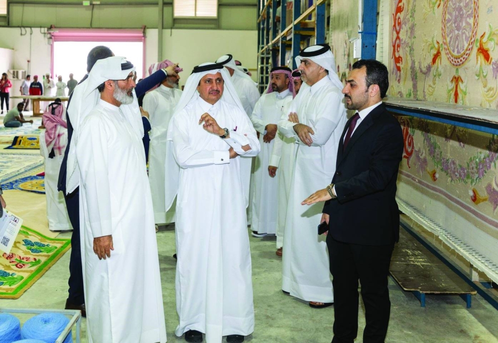 Chairman of Qatar Chamber Sheikh Khalifa bin Jassim al-Thani on a tour of Engineering Factory for Carpets in the New Industrial Area.