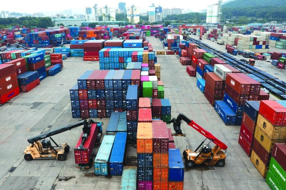 Reach stackers transport containers at the Uiwang Inland Container Depot in South Korea. Qatar National Bank expected an improvement in global trade volumes during the second quarter of 2023, with signs of more stability emerging.