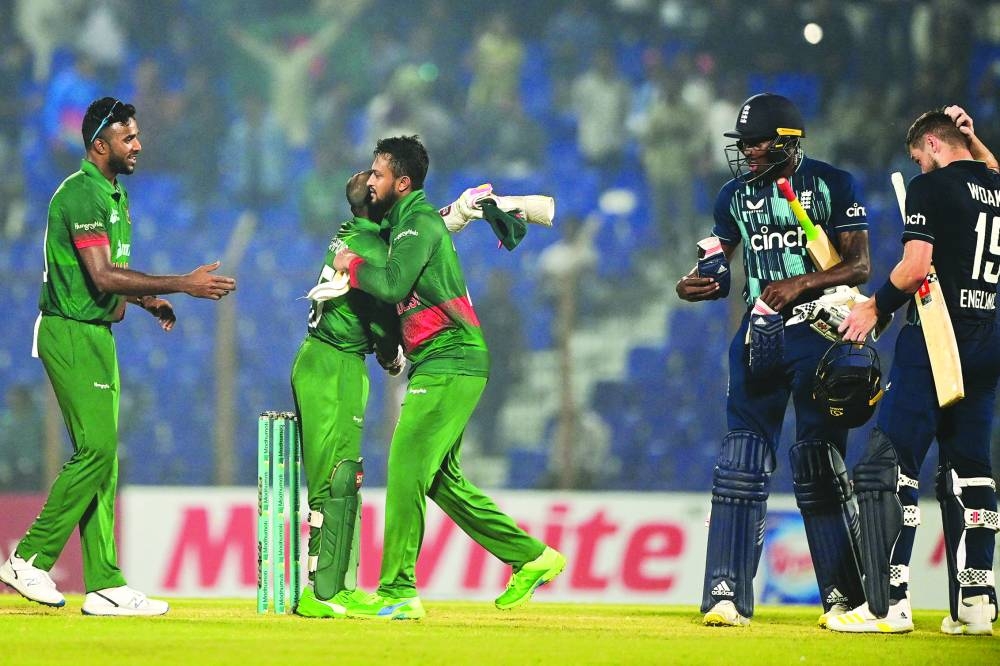 Bangladesh’s Shakib Al Hasan (centre) greets his teammate Mushfiqur Rahim as England’s Chris Woakes (right) and Jofra Archer (second right) gesture during the third ODI on Monday. (AFP)