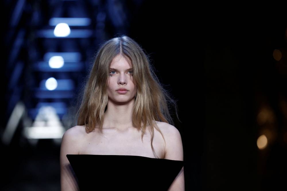 A model presents a creation by designer Nicolas Ghesquiere as part of his Fall-Winter 2023/2024 Women's ready-to-wear collection show for fashion house Louis Vuitton during Paris Fashion Week in Paris, France, March 6, 2023. REUTERS/Benoit Tessier